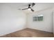 Simple bedroom with wood floors and ceiling fan at 2614 E Mountain View Rd, Phoenix, AZ 85028