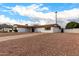 Front view of a single story house with rock driveway at 2614 E Mountain View Rd, Phoenix, AZ 85028