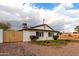 House exterior with wood gate and rock landscaping at 2614 E Mountain View Rd, Phoenix, AZ 85028