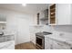 Sleek kitchen with stainless steel appliances and white cabinets at 2614 E Mountain View Rd, Phoenix, AZ 85028