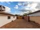 Gravel side yard with wooden gate and block wall at 2614 E Mountain View Rd, Phoenix, AZ 85028