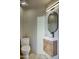 Modern bathroom with floating vanity and oval mirror at 26905 N 98Th Way, Scottsdale, AZ 85262