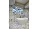 Spa-like bathroom with a large walk-in shower and soaking tub at 26905 N 98Th Way, Scottsdale, AZ 85262