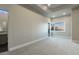 Bright bedroom with large window and en-suite bathroom at 26905 N 98Th Way, Scottsdale, AZ 85262