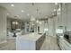 Modern kitchen with large island, breakfast bar, and open floor plan at 26905 N 98Th Way, Scottsdale, AZ 85262