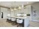 Gourmet kitchen with large island, stainless steel appliances, and white cabinetry at 26905 N 98Th Way, Scottsdale, AZ 85262