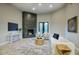 Living room with a modern fireplace and access to balcony at 26905 N 98Th Way, Scottsdale, AZ 85262