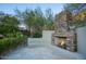 Outdoor patio with stone fireplace and seating area at 26905 N 98Th Way, Scottsdale, AZ 85262