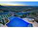 Luxury pool and spa with mountain views at sunset at 26905 N 98Th Way, Scottsdale, AZ 85262