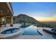 Luxury pool and spa with mountain views and sunset at 26905 N 98Th Way, Scottsdale, AZ 85262