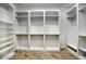 Spacious walk-in closet with built-in shelves and hanging rods at 26905 N 98Th Way, Scottsdale, AZ 85262