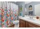 Bathroom with shower/tub combo and floral shower curtain at 2739 W Via Bona Fortuna Dr, Phoenix, AZ 85086