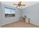 Cozy bedroom featuring a ceiling fan and built-in shelving at 2739 W Via Bona Fortuna Dr, Phoenix, AZ 85086