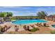 Community pool with plenty of lounge chairs for residents at 2739 W Via Bona Fortuna Dr, Phoenix, AZ 85086