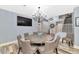 Elegant dining room with a large table and chandelier at 2739 W Via Bona Fortuna Dr, Phoenix, AZ 85086