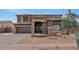 Two-story home with stone accents and a three-car garage at 2739 W Via Bona Fortuna Dr, Phoenix, AZ 85086