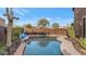 Relaxing kidney-shaped pool with patio furniture at 2739 W Via Bona Fortuna Dr, Phoenix, AZ 85086