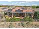 Aerial view of home with solar panels and a backyard patio at 29432 N 128Th Ln, Peoria, AZ 85383