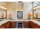 Elegant bathroom with double sinks, a large soaking tub, and a separate shower at 29432 N 128Th Ln, Peoria, AZ 85383