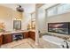 Spa-like bathroom with soaking tub and dual vanities at 29432 N 128Th Ln, Peoria, AZ 85383