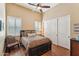 Comfortable bedroom with a queen-size bed and ample closet space at 29432 N 128Th Ln, Peoria, AZ 85383