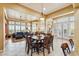 Kitchen dining area with a large table and access to the living room at 29432 N 128Th Ln, Peoria, AZ 85383