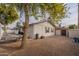 Backyard view showing side of house, gravel, and hammock at 3002 E Mitchell Dr, Phoenix, AZ 85016