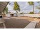 Spacious backyard with gravel, detached garage, and landscaping at 3002 E Mitchell Dr, Phoenix, AZ 85016