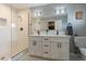 Updated bathroom with double vanity, glass shower, and modern fixtures at 3002 E Mitchell Dr, Phoenix, AZ 85016