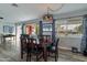 Bright dining room with wood table and chairs, offering ample natural light at 3002 E Mitchell Dr, Phoenix, AZ 85016