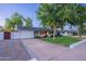 Charming single-story home with a well-manicured lawn and mature trees offering great curb appeal at 3002 E Mitchell Dr, Phoenix, AZ 85016