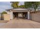 Garage with open door and storage space at 3002 E Mitchell Dr, Phoenix, AZ 85016