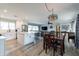 Modern kitchen with white cabinets, island, and stainless steel appliances at 3002 E Mitchell Dr, Phoenix, AZ 85016