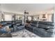 Spacious living room with grey leather recliners and a decorative rug at 3002 E Mitchell Dr, Phoenix, AZ 85016