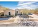 One-story house with desert landscaping, driveway, and a three-car garage at 32807 N 15Th Gln, Phoenix, AZ 85085