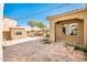 Outdoor patio with fireplace, string lights, and stone flooring at 32807 N 15Th Gln, Phoenix, AZ 85085