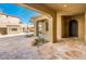 Covered patio area with a view of the backyard and outdoor fireplace at 32807 N 15Th Gln, Phoenix, AZ 85085