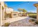 Outdoor patio with fireplace, string lights, and stone flooring at 32807 N 15Th Gln, Phoenix, AZ 85085