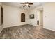 Relaxing bedroom with wood-look floors and ceiling fan at 32807 N 15Th Gln, Phoenix, AZ 85085