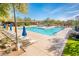 Relaxing pool area with lounge chairs and umbrellas for residents at 32807 N 15Th Gln, Phoenix, AZ 85085