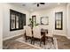 Formal dining room with hardwood floors and stylish light fixture at 32807 N 15Th Gln, Phoenix, AZ 85085