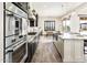 Bright kitchen with stainless steel appliances and a farmhouse sink at 32807 N 15Th Gln, Phoenix, AZ 85085