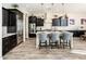 Elegant kitchen featuring dark cabinetry, granite counters and stainless steel appliances at 32807 N 15Th Gln, Phoenix, AZ 85085