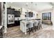 Modern kitchen with dark cabinets, granite counters, and an island at 32807 N 15Th Gln, Phoenix, AZ 85085