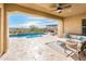 Covered patio with pool, seating area, and mountain views at 32807 N 15Th Gln, Phoenix, AZ 85085