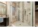 Spa-like shower with tiled walls and built-in seat at 32807 N 15Th Gln, Phoenix, AZ 85085