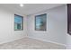 Simple bedroom with two windows and neutral-colored walls at 35134 N Laredo Dr, San Tan Valley, AZ 85144