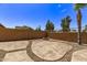 Spacious flagstone patio with fire pit perfect for outdoor entertaining at 35134 N Laredo Dr, San Tan Valley, AZ 85144