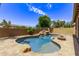 Relaxing kidney-shaped pool with a rock waterfall feature at 35134 N Laredo Dr, San Tan Valley, AZ 85144