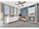 Spacious bedroom with white dresser and a blue accent wall at 37762 N Poplar Rd, San Tan Valley, AZ 85140